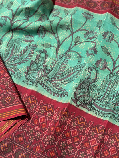 THARAGAI - Handknotted tie dyed Bhandej Ikkat silk saree with hand drawn and handpainted Penkanamkari Saree