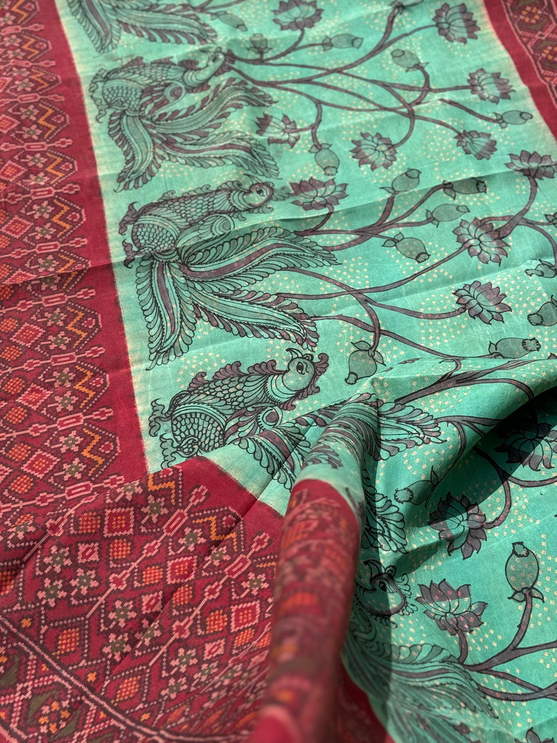 THARAGAI - Handknotted tie dyed Bhandej Ikkat silk saree with hand drawn and handpainted Penkanamkari Saree