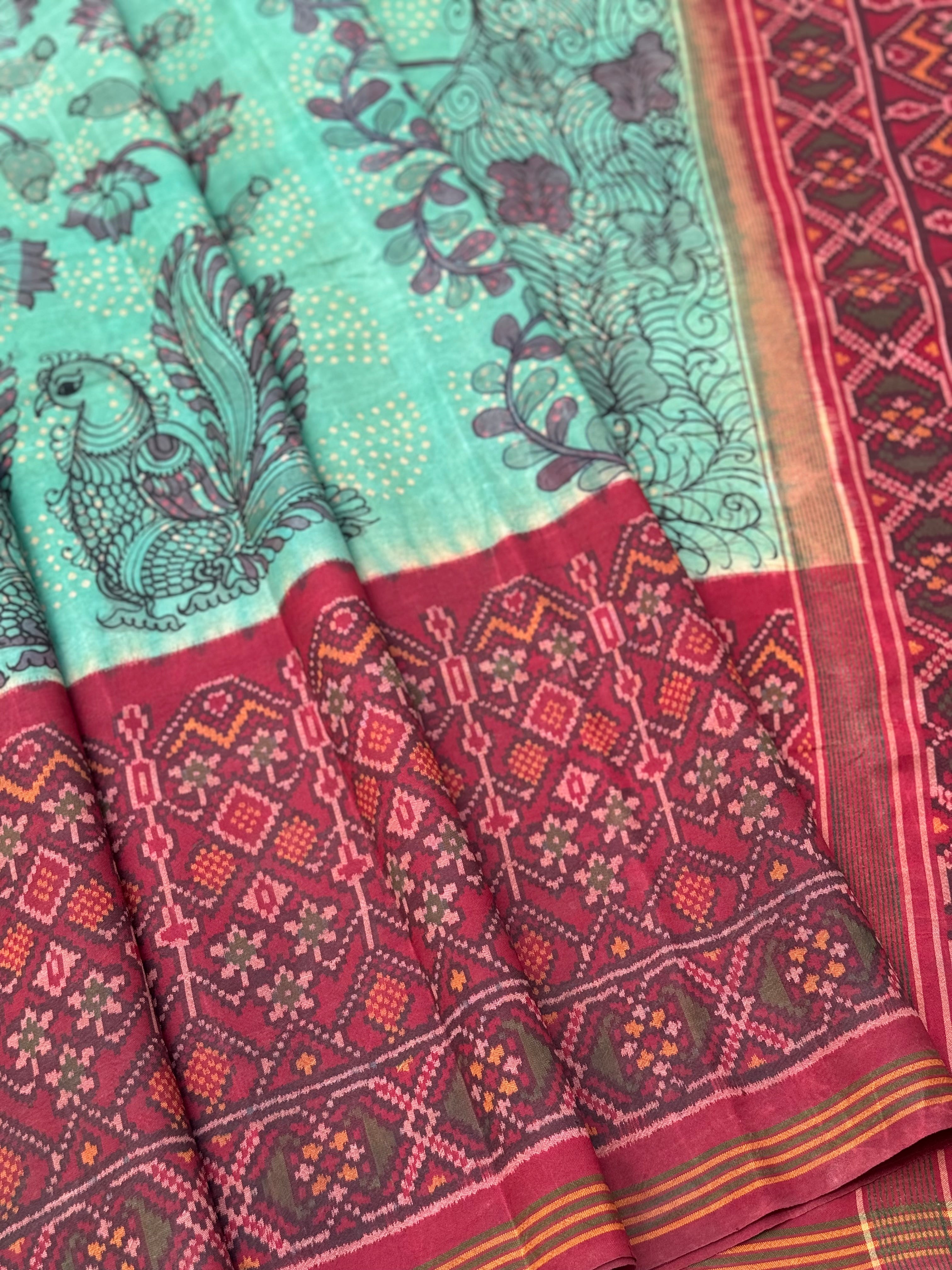 THARAGAI - Handknotted tie dyed Bhandej Ikkat silk saree with hand drawn and handpainted Penkanamkari Saree