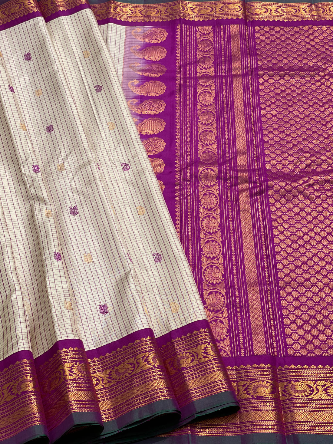 An elegant checks Pearl white with purple Gadwal silk saree