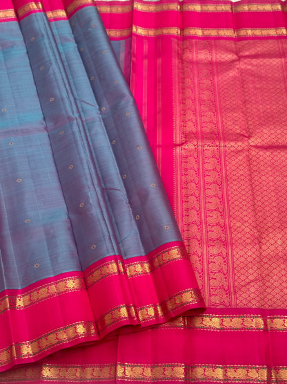 A Masterpiece kanchivaram korvai silk saree in peacock blue with pink
