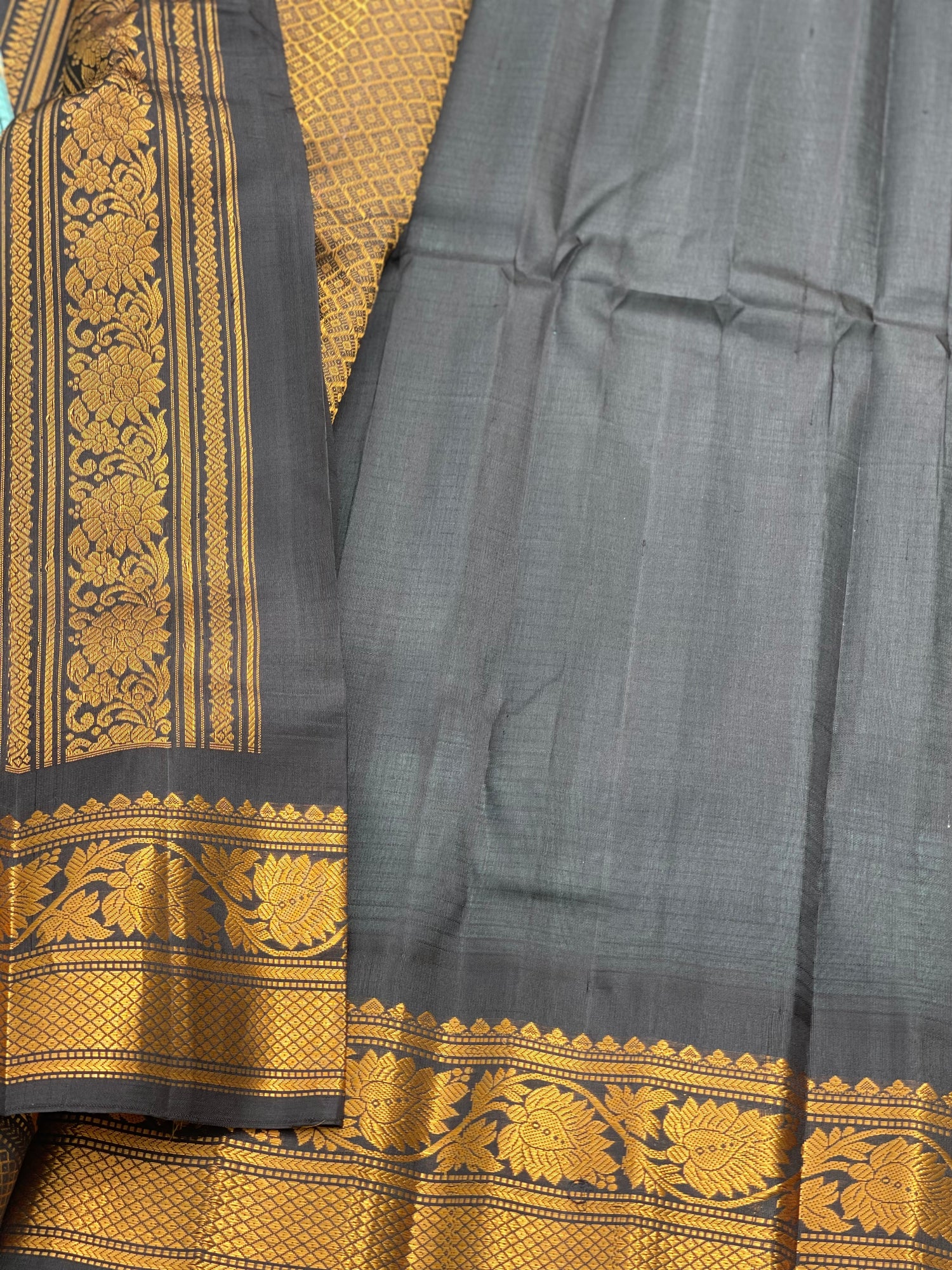 An elegant seablue with black checks Gadwal silk saree