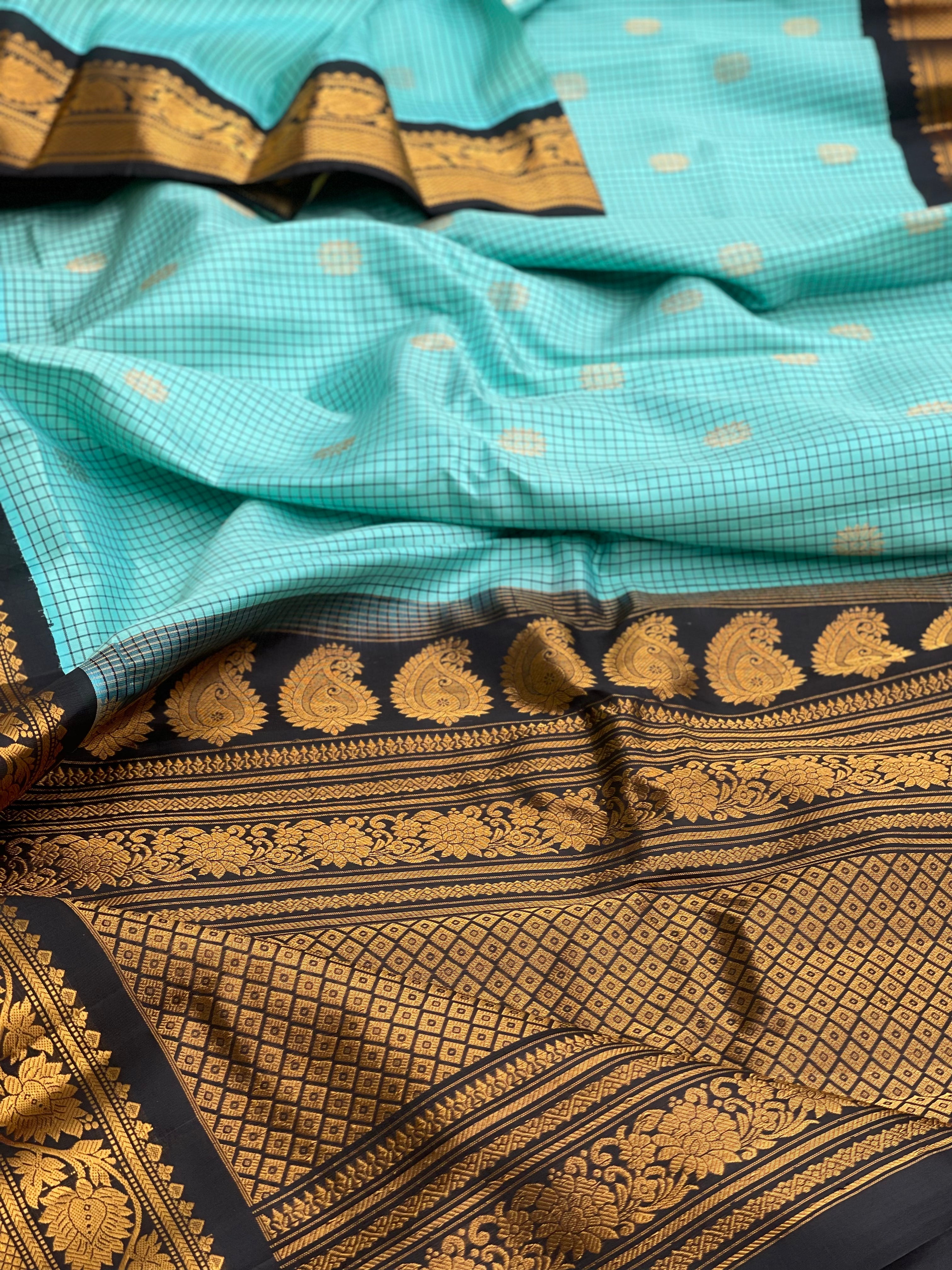 An elegant seablue with black checks Gadwal silk saree
