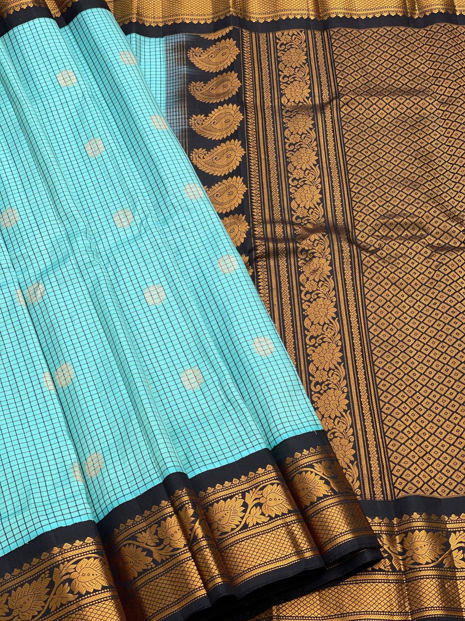 An elegant seablue with black checks Gadwal silk saree
