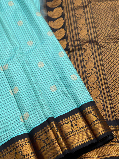 An elegant seablue with black checks Gadwal silk saree