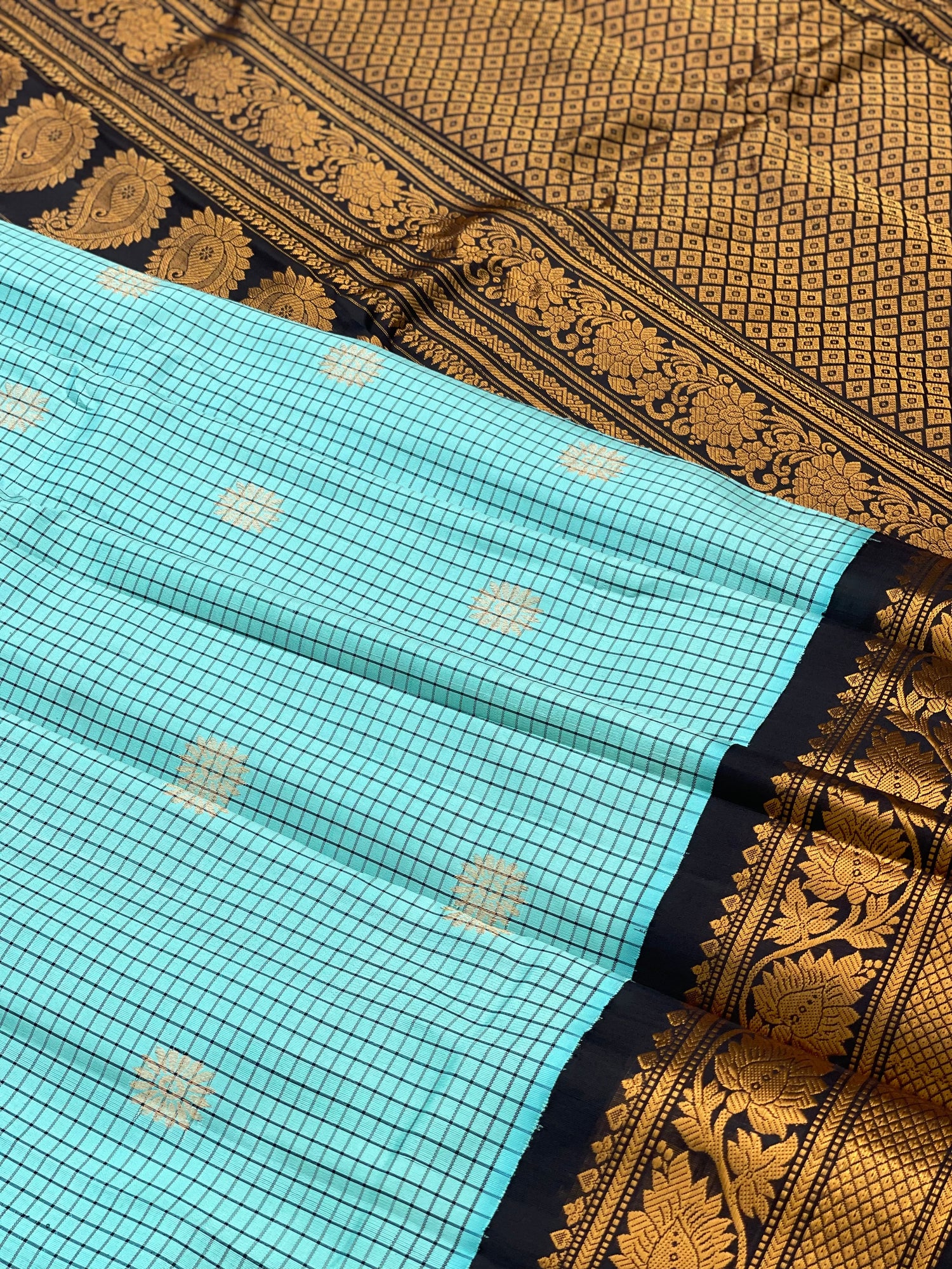 An elegant seablue with black checks Gadwal silk saree