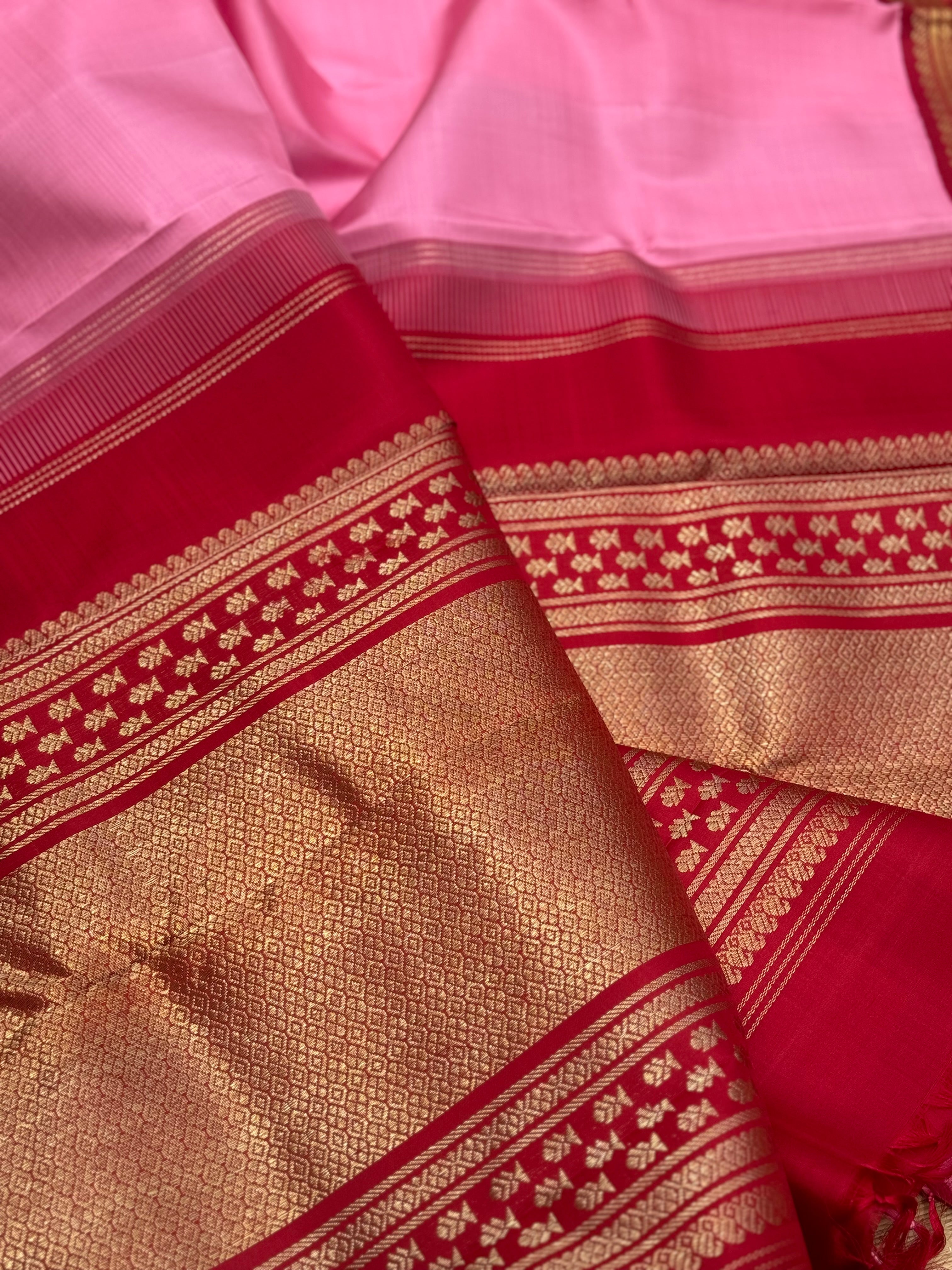A gorgeous masterpiece in a very unique pink with arakku shade meenpettu border, korvai Kanchivaram silk saree