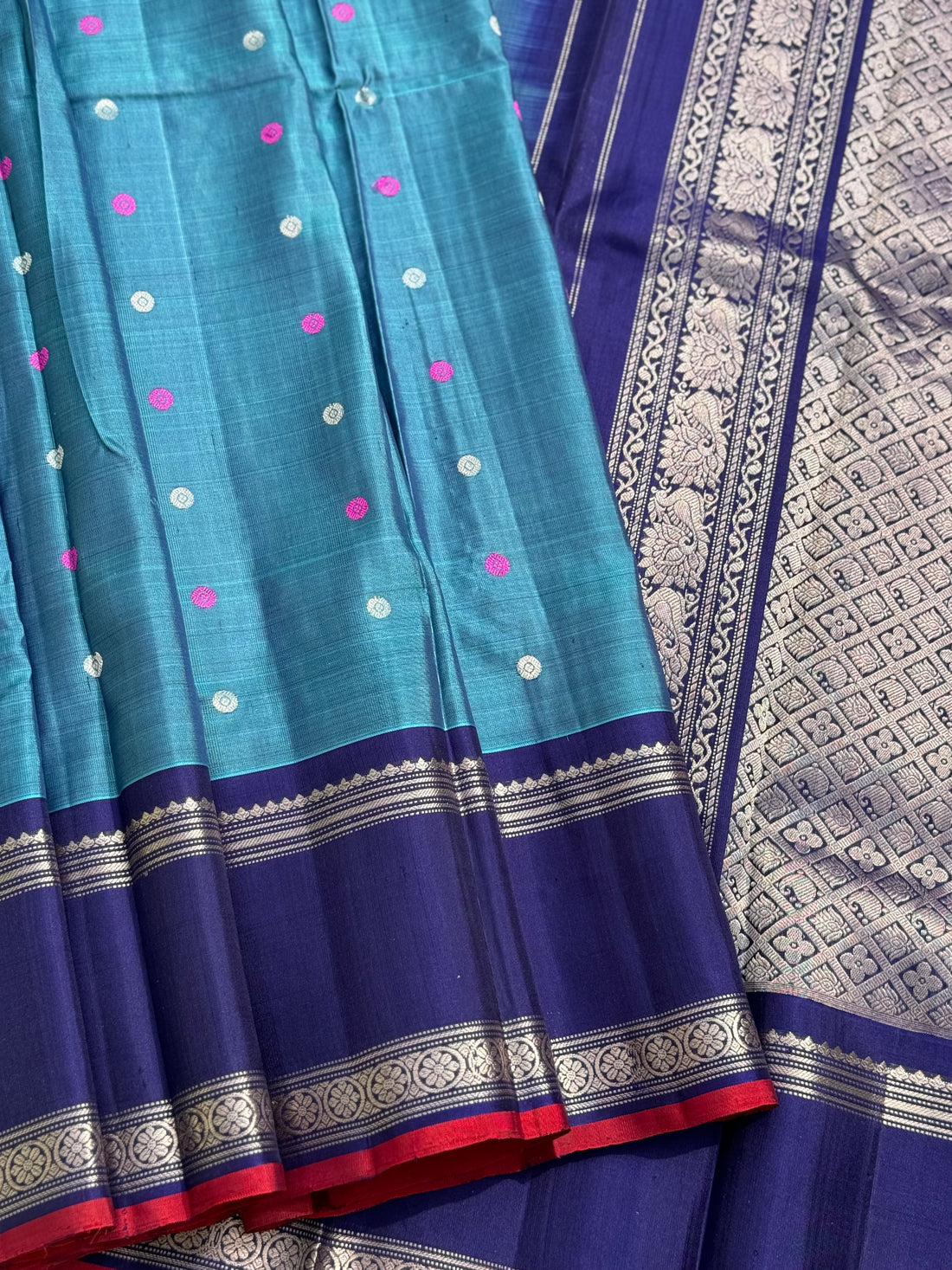 A gorgeous peacock teal handwoven gadwal silk saree