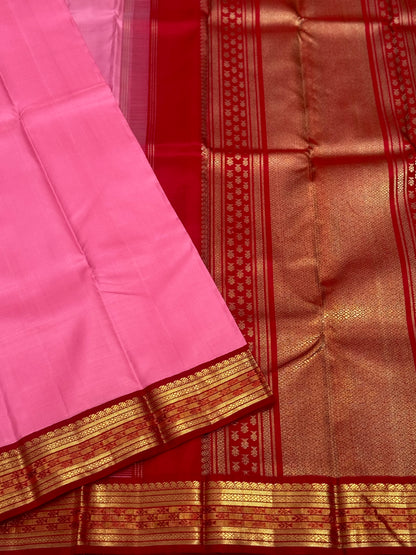 A gorgeous masterpiece in a very unique pink with arakku shade meenpettu border, korvai Kanchivaram silk saree