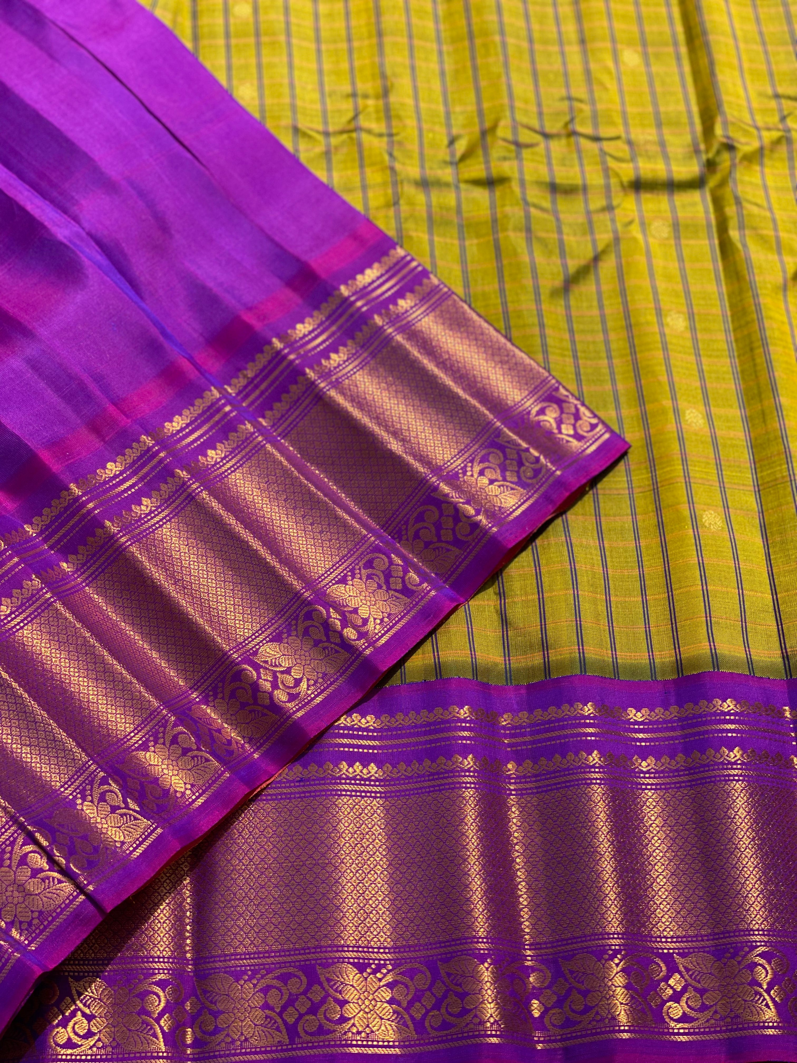 A stunner shot mustard yellow shade Gadwal silk saree