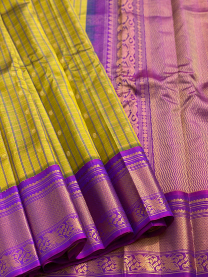 A stunner shot mustard yellow shade Gadwal silk saree