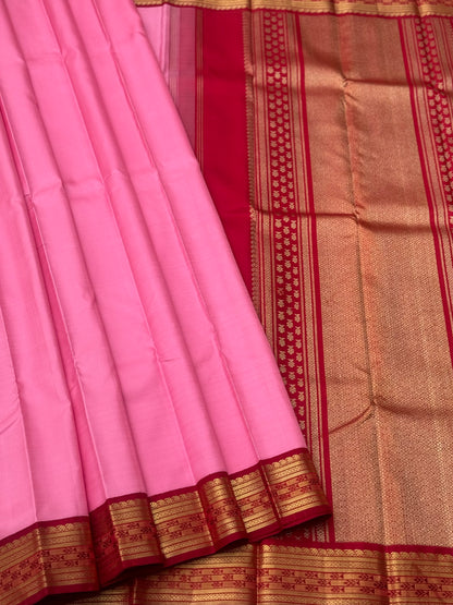 A gorgeous masterpiece in a very unique pink with arakku shade meenpettu border, korvai Kanchivaram silk saree