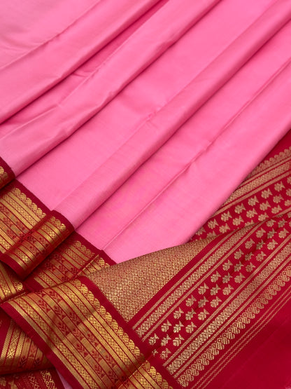 A gorgeous masterpiece in a very unique pink with arakku shade meenpettu border, korvai Kanchivaram silk saree
