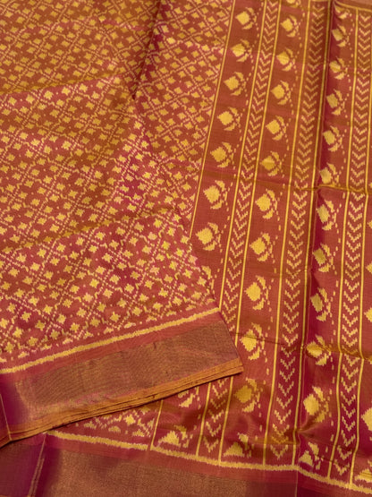 A gorgeous shot peach with pink single ikkat patola silk saree