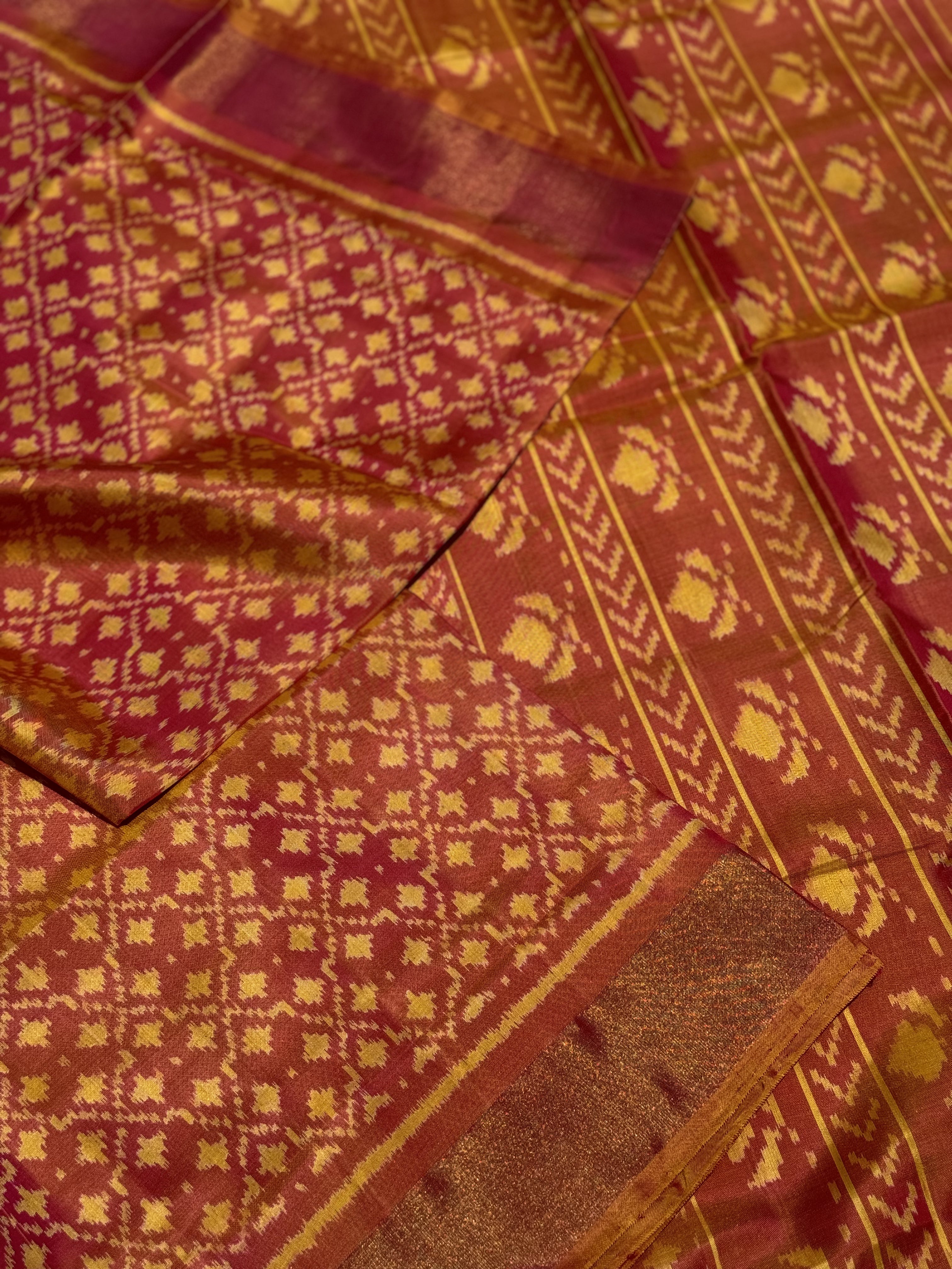 A gorgeous shot peach with pink single ikkat patola silk saree