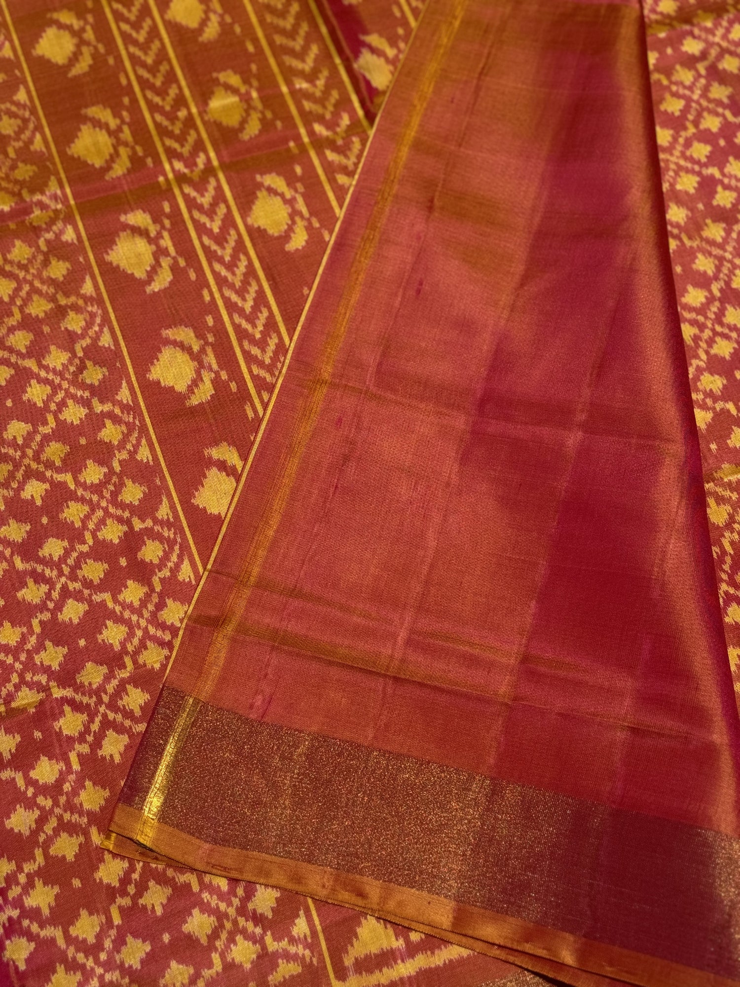 A gorgeous shot peach with pink single ikkat patola silk saree