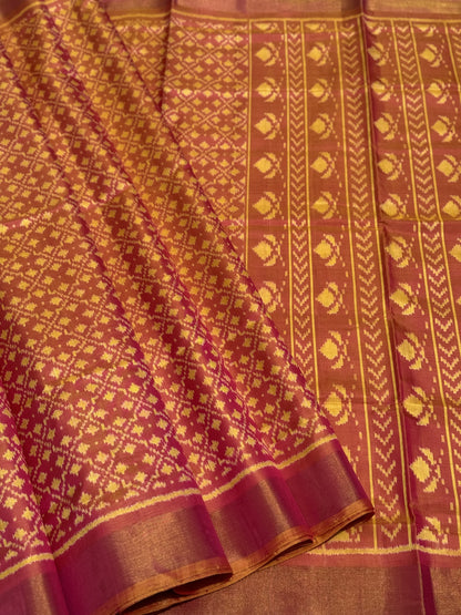 A gorgeous shot peach with pink single ikkat patola silk saree