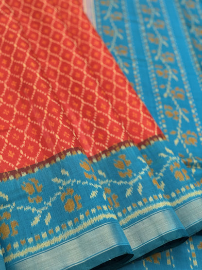 A gorgeous burnt Orange with teal single ikkat patola silk saree