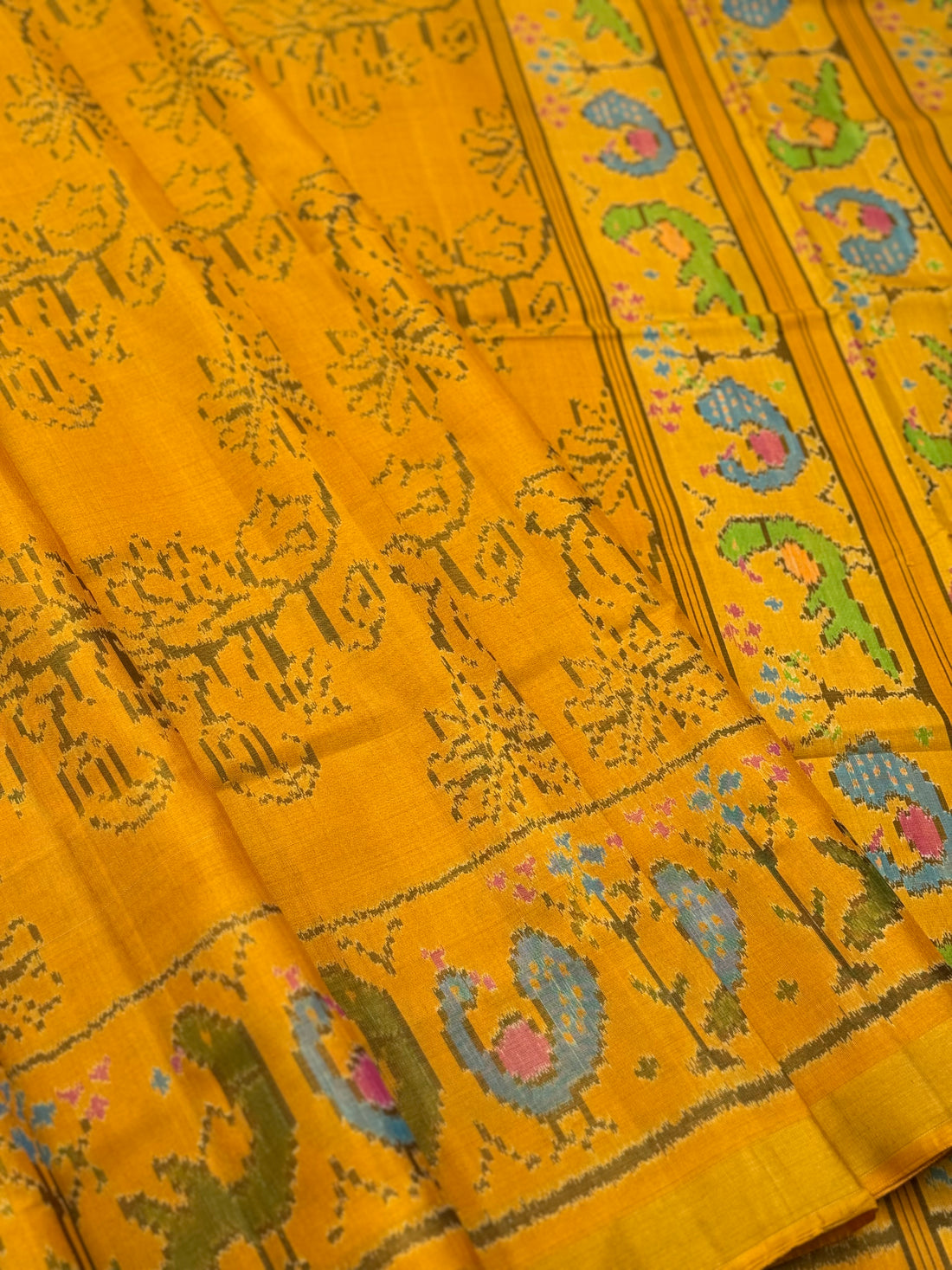 A gorgeous mustard yellow shade single ikkat patola silk SAREE