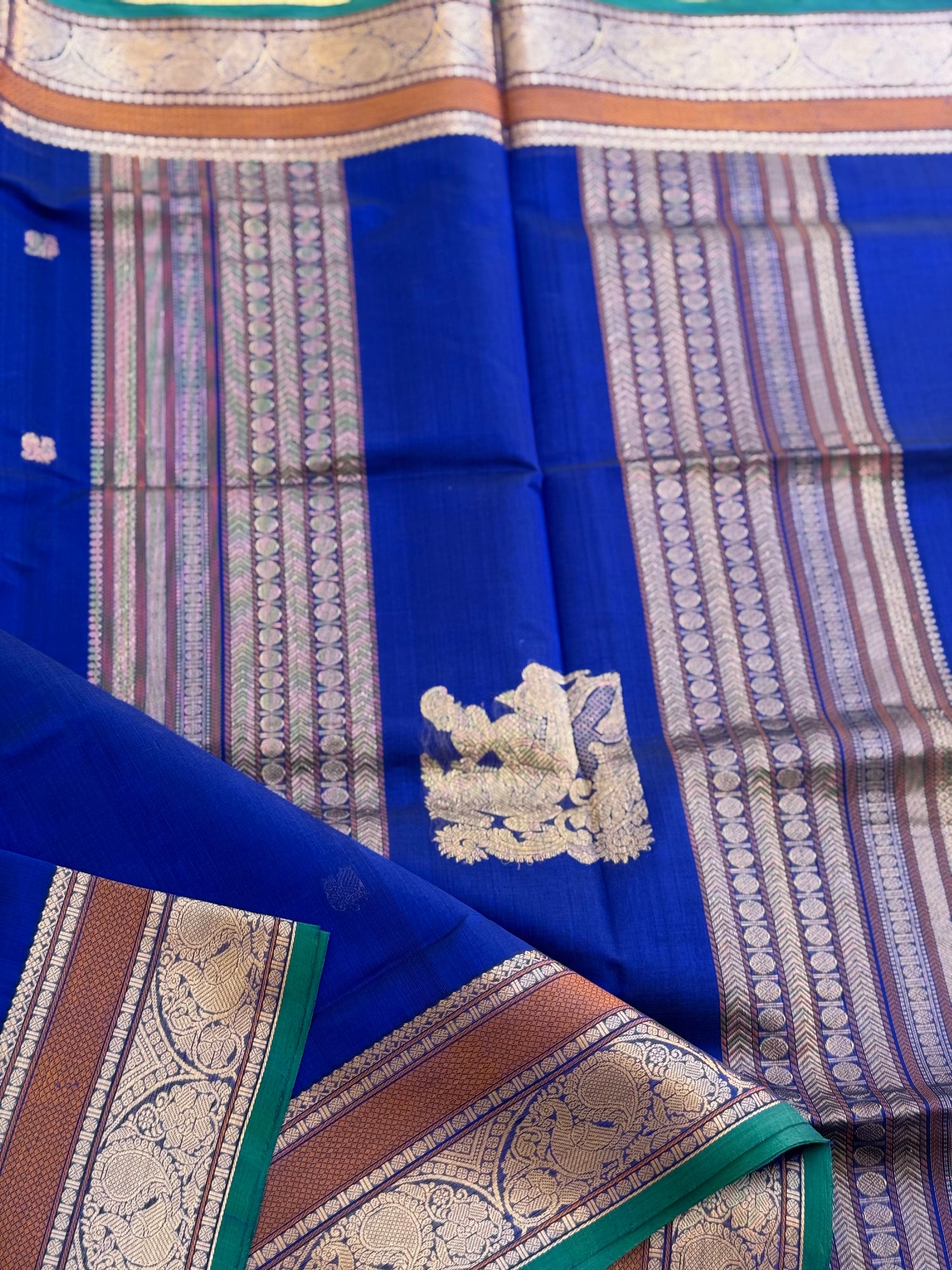 Ms blue Kanchi silk cotton saree with conia buttas