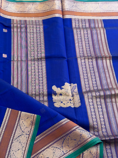 Ms blue Kanchi silk cotton saree with conia buttas