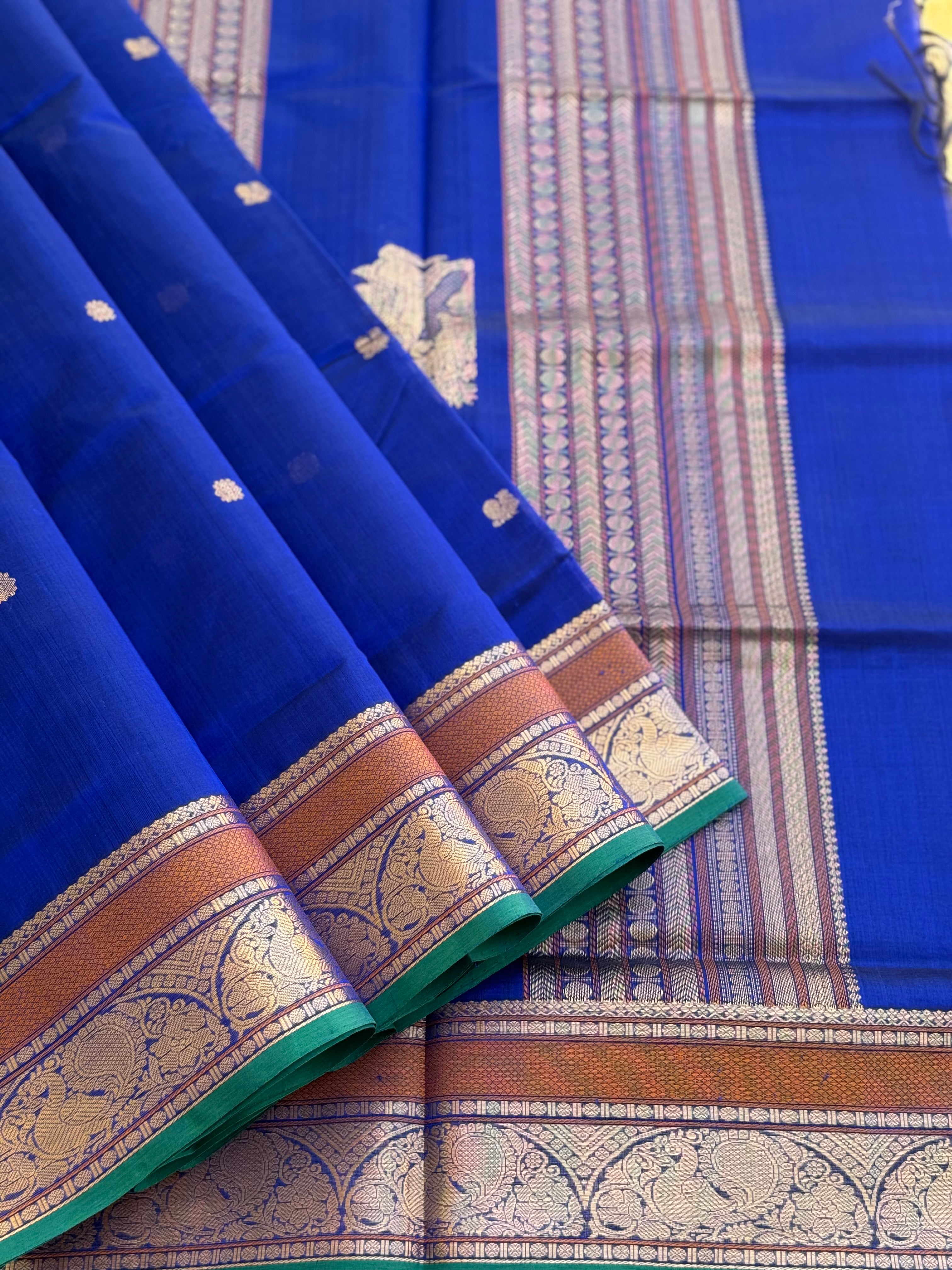 Ms blue Kanchi silk cotton saree with conia buttas