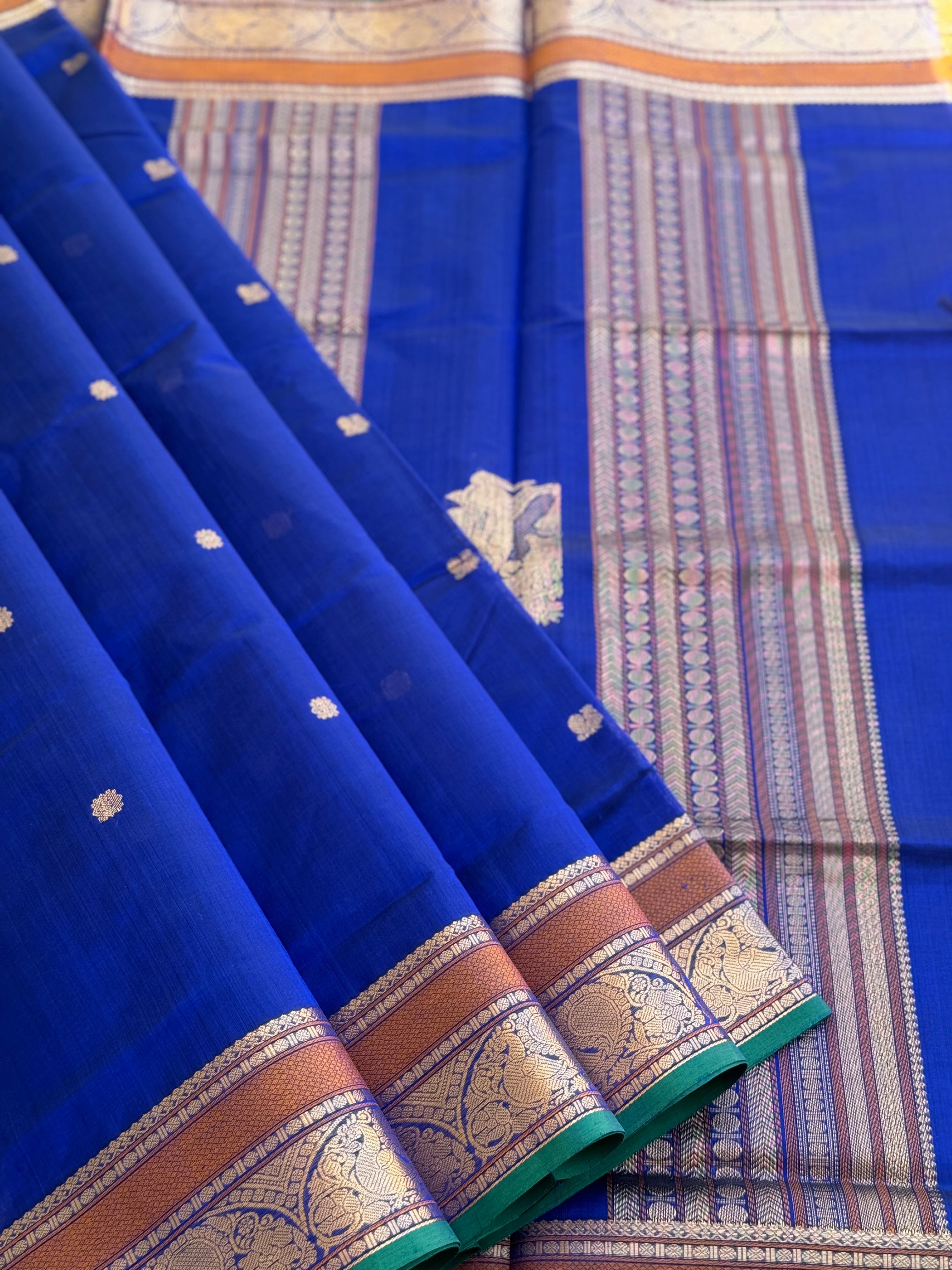 Ms blue Kanchi silk cotton saree with conia buttas
