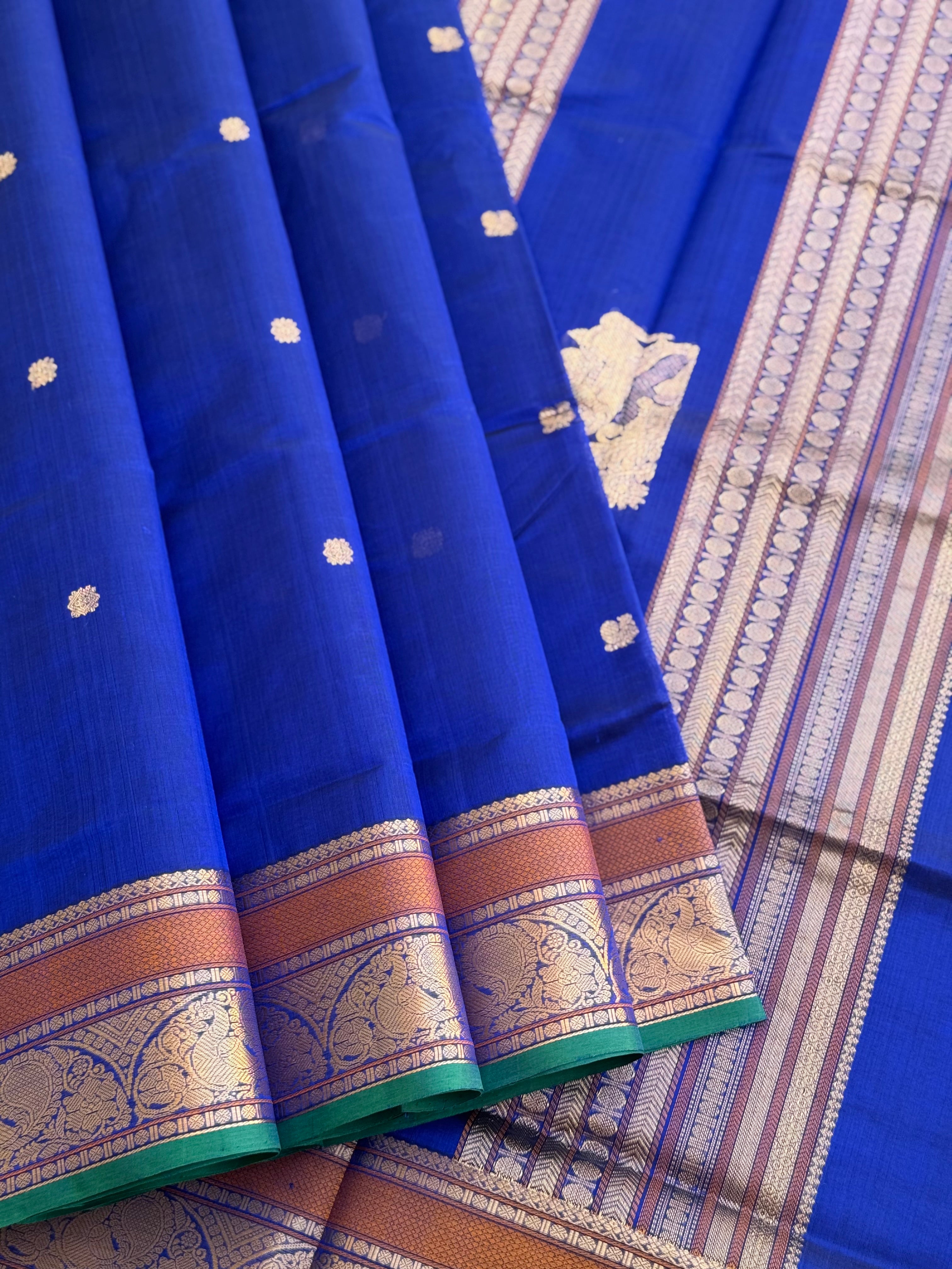 Ms blue Kanchi silk cotton saree with conia buttas