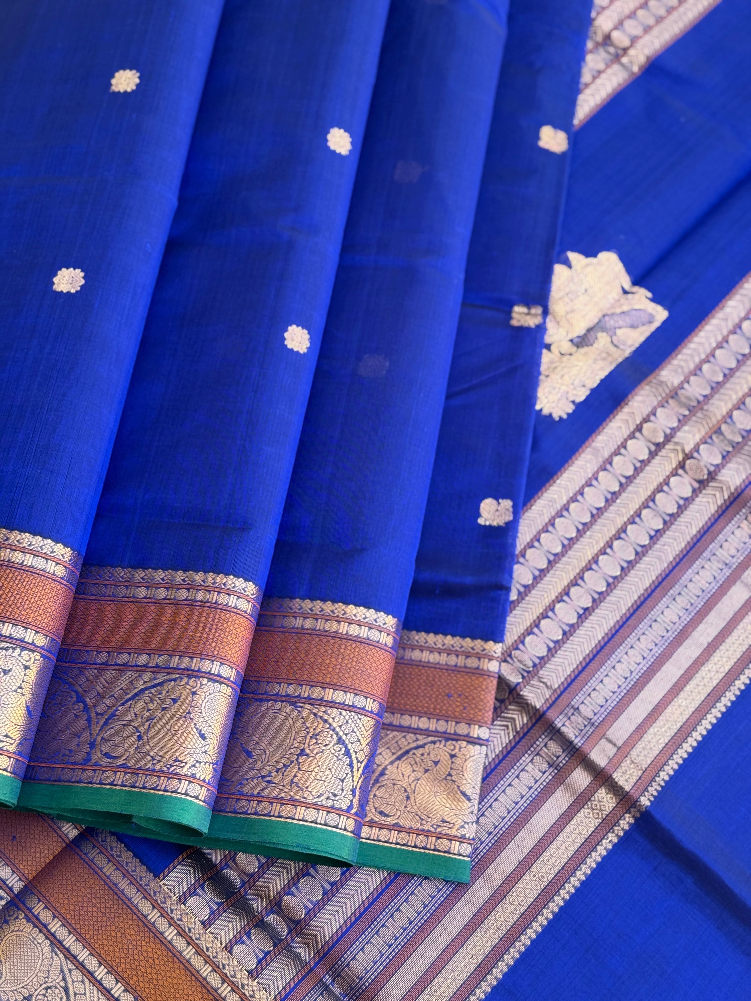 Ms blue Kanchi silk cotton saree with conia buttas
