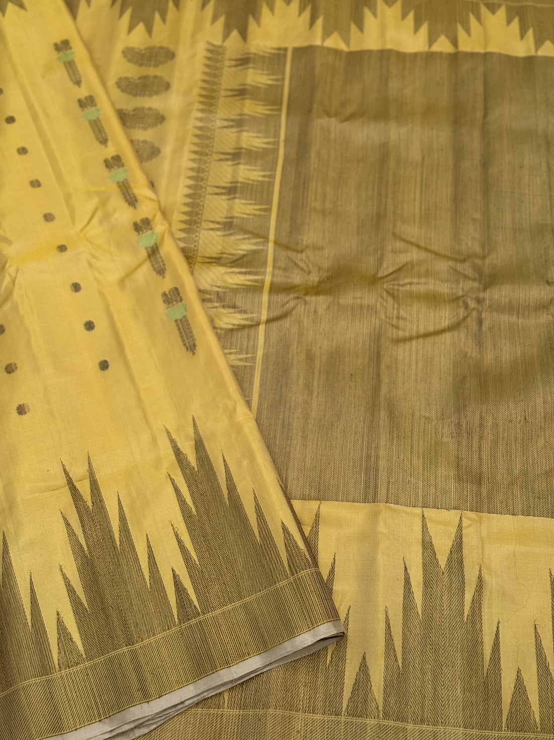 A gorgeous pastel yellow handwoven soft and lustrous temple woven gadwal silk saree