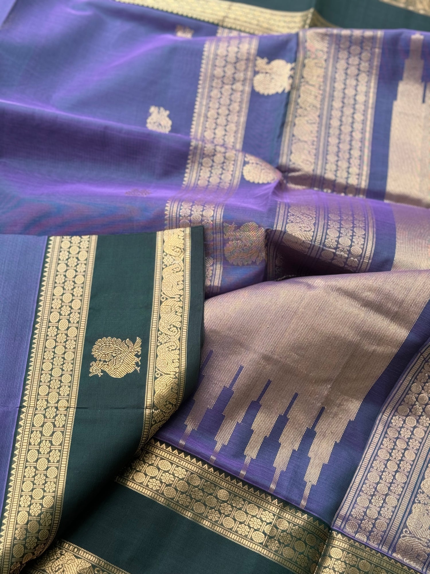 A gorgeous lavender with bottlegreen handwoven horsemotifs  Kanchi silk cotton saree
