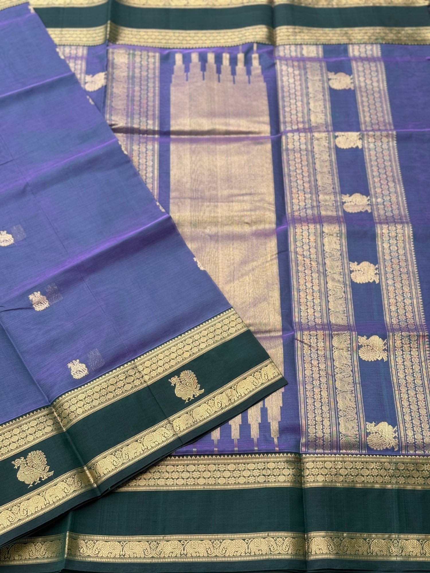 A gorgeous lavender with bottlegreen handwoven horsemotifs  Kanchi silk cotton saree