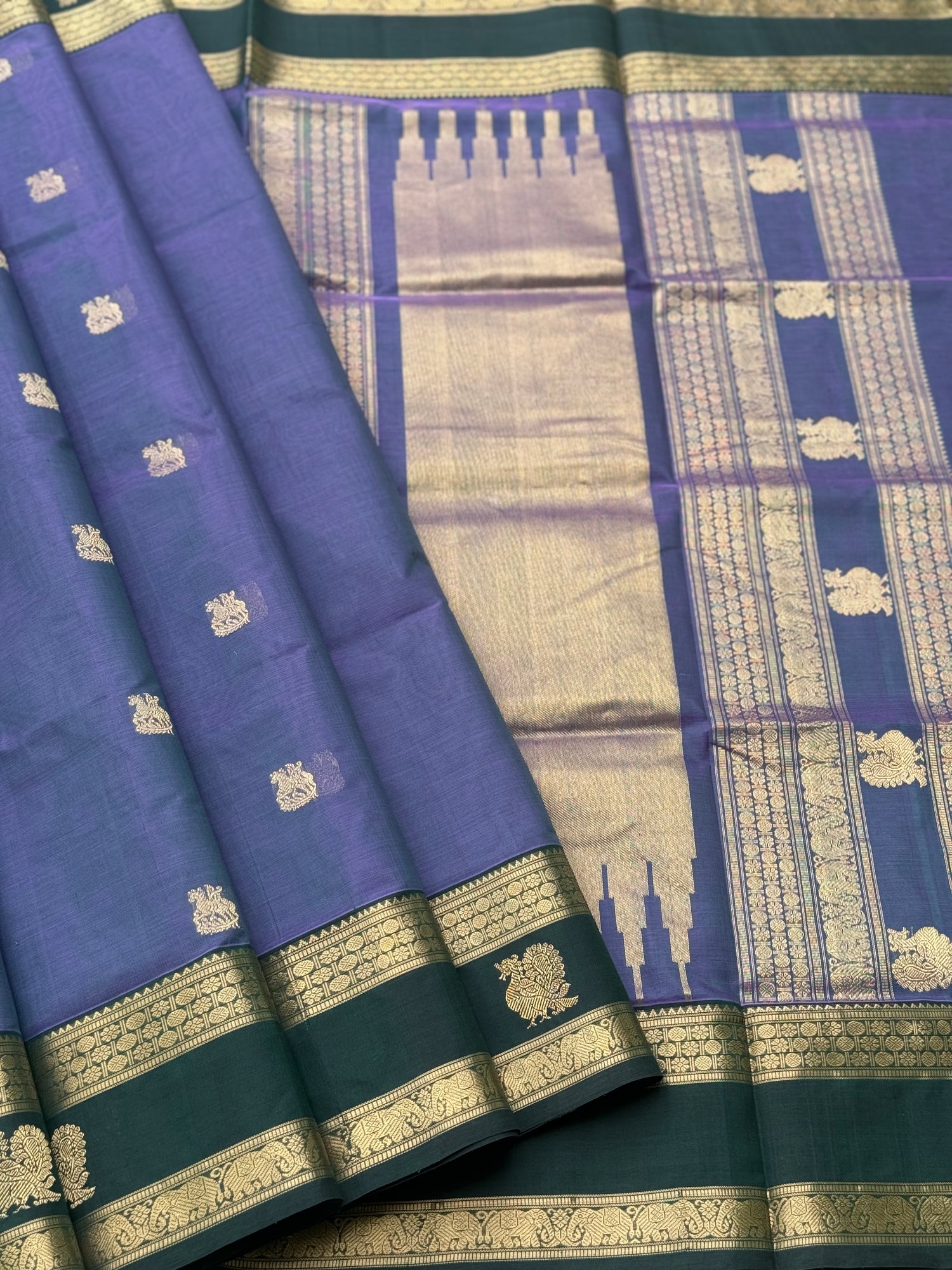 A gorgeous lavender with bottlegreen handwoven horsemotifs  Kanchi silk cotton saree