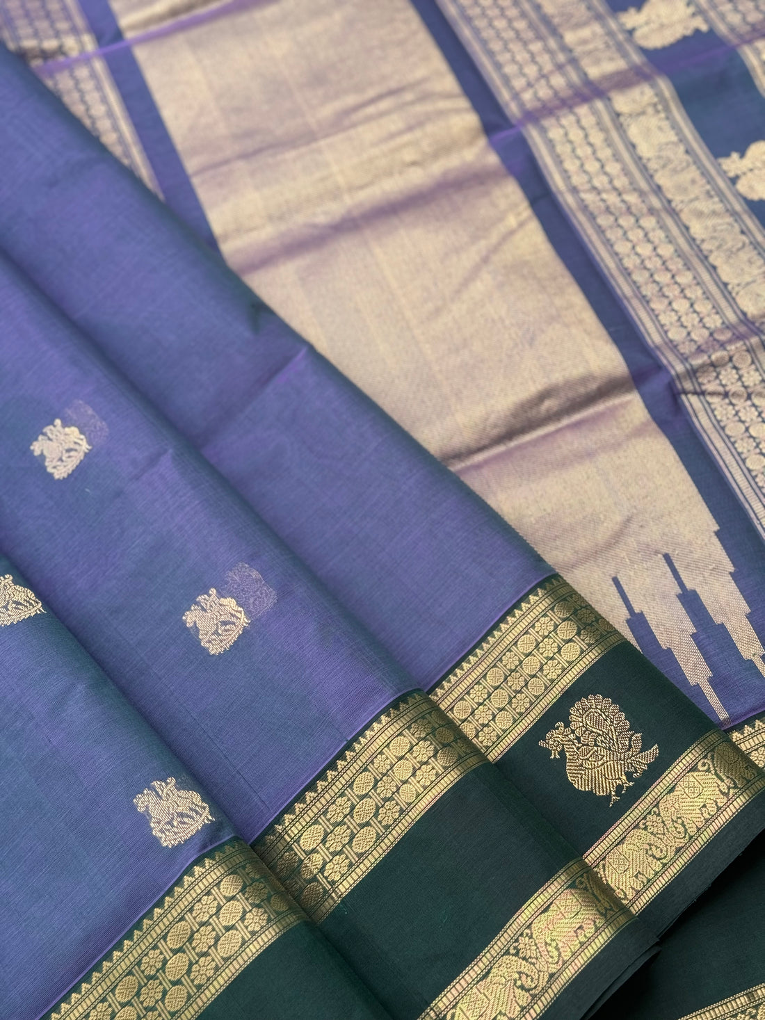 A gorgeous lavender with bottlegreen handwoven horsemotifs  Kanchi silk cotton saree