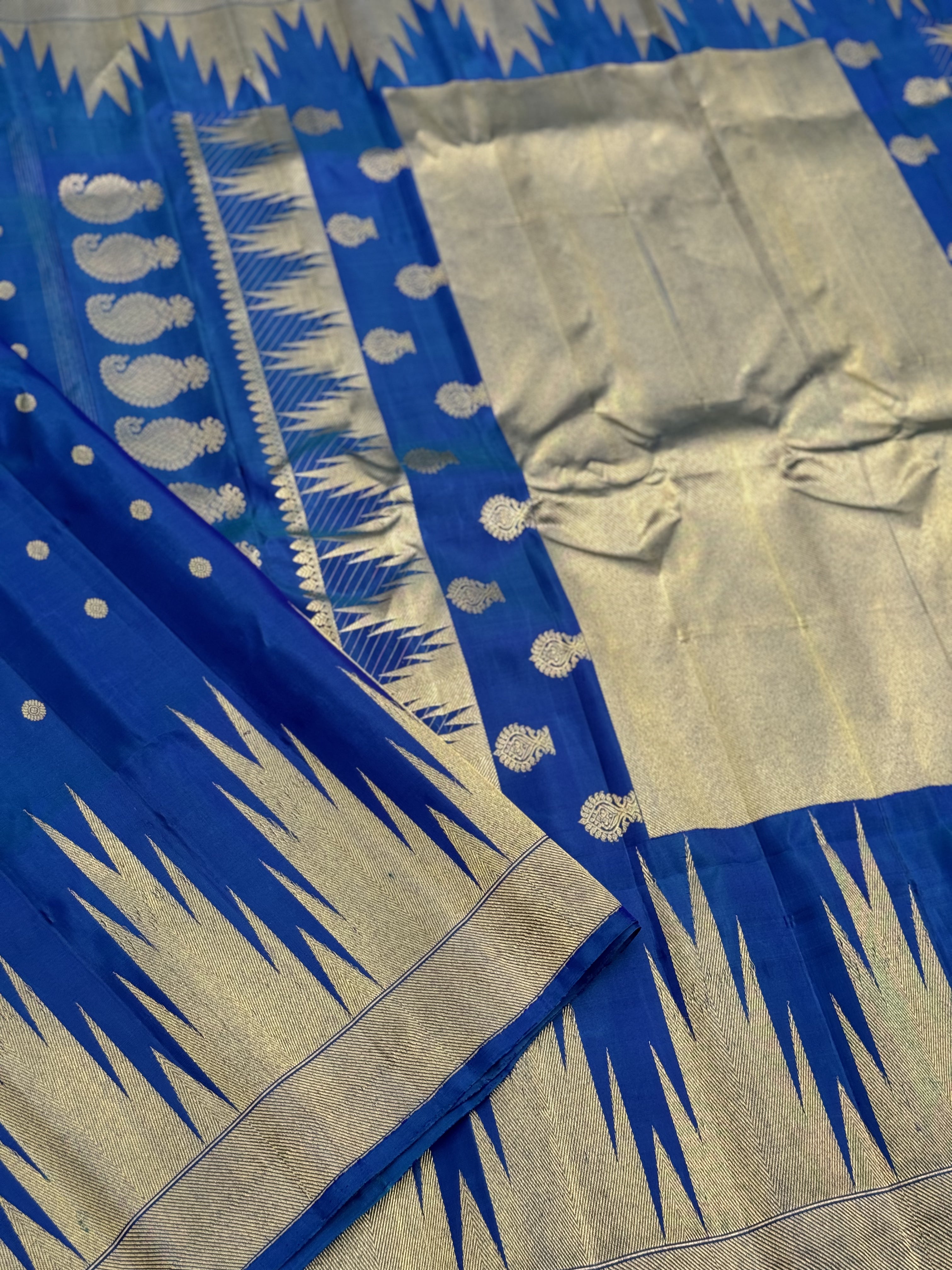 APURVA - Handwoven A gorgeous antique gold with zari woven peacock blue gadwal saree