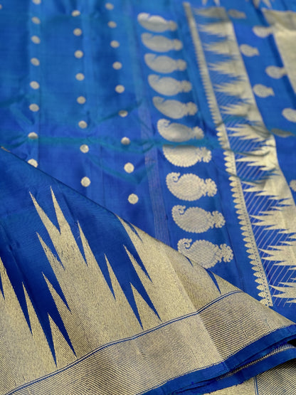 APURVA - Handwoven A gorgeous antique gold with zari woven peacock blue gadwal saree