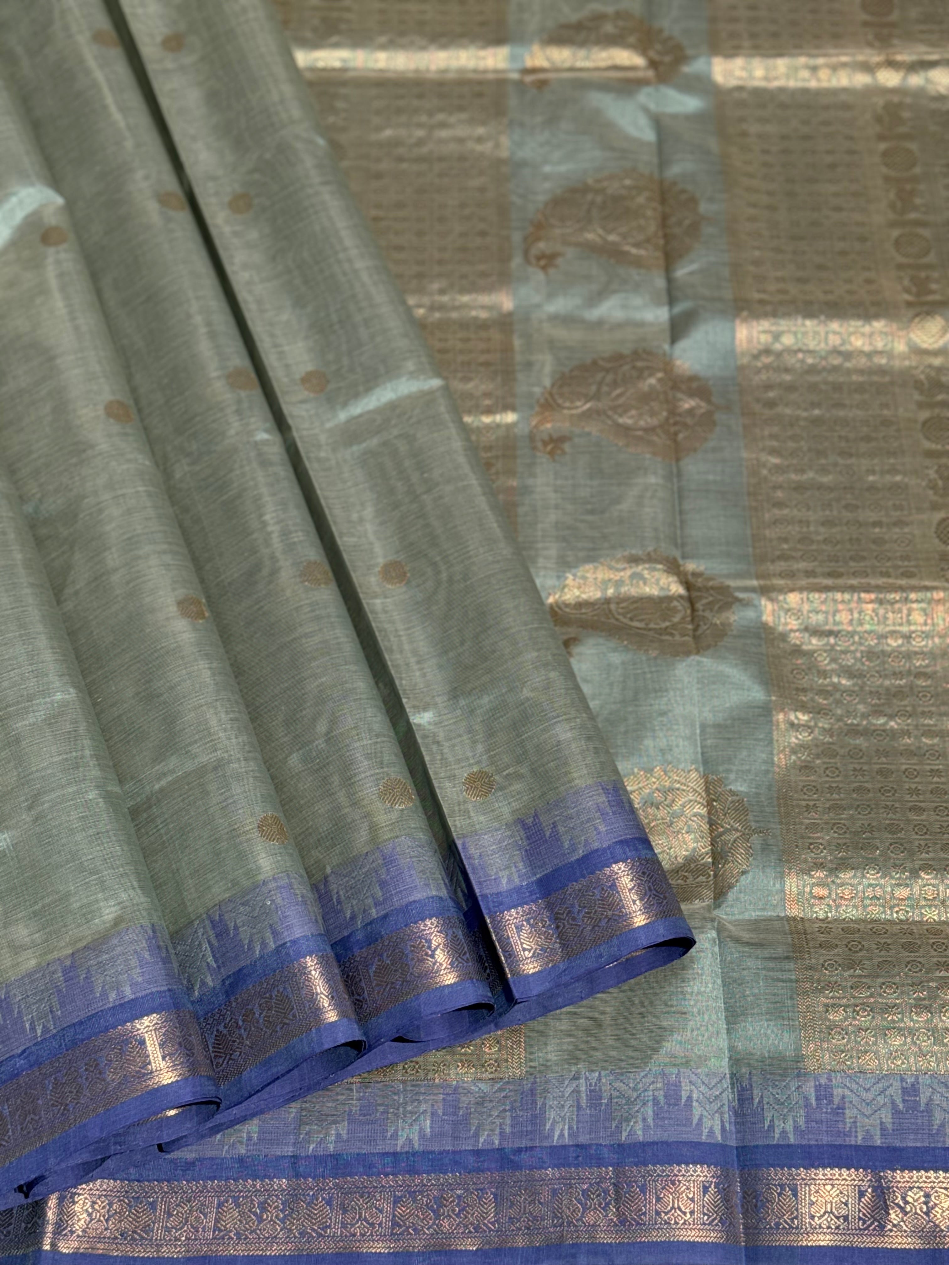 Kanchi silk cotton saree in sage green with blue shade zari woven