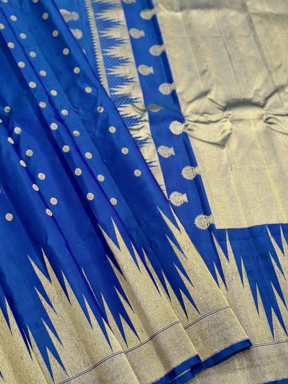 APURVA - Handwoven A gorgeous antique gold with zari woven peacock blue gadwal saree