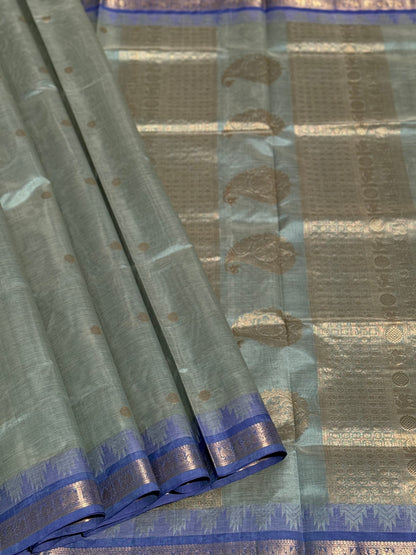 Kanchi silk cotton saree in sage green with blue shade zari woven