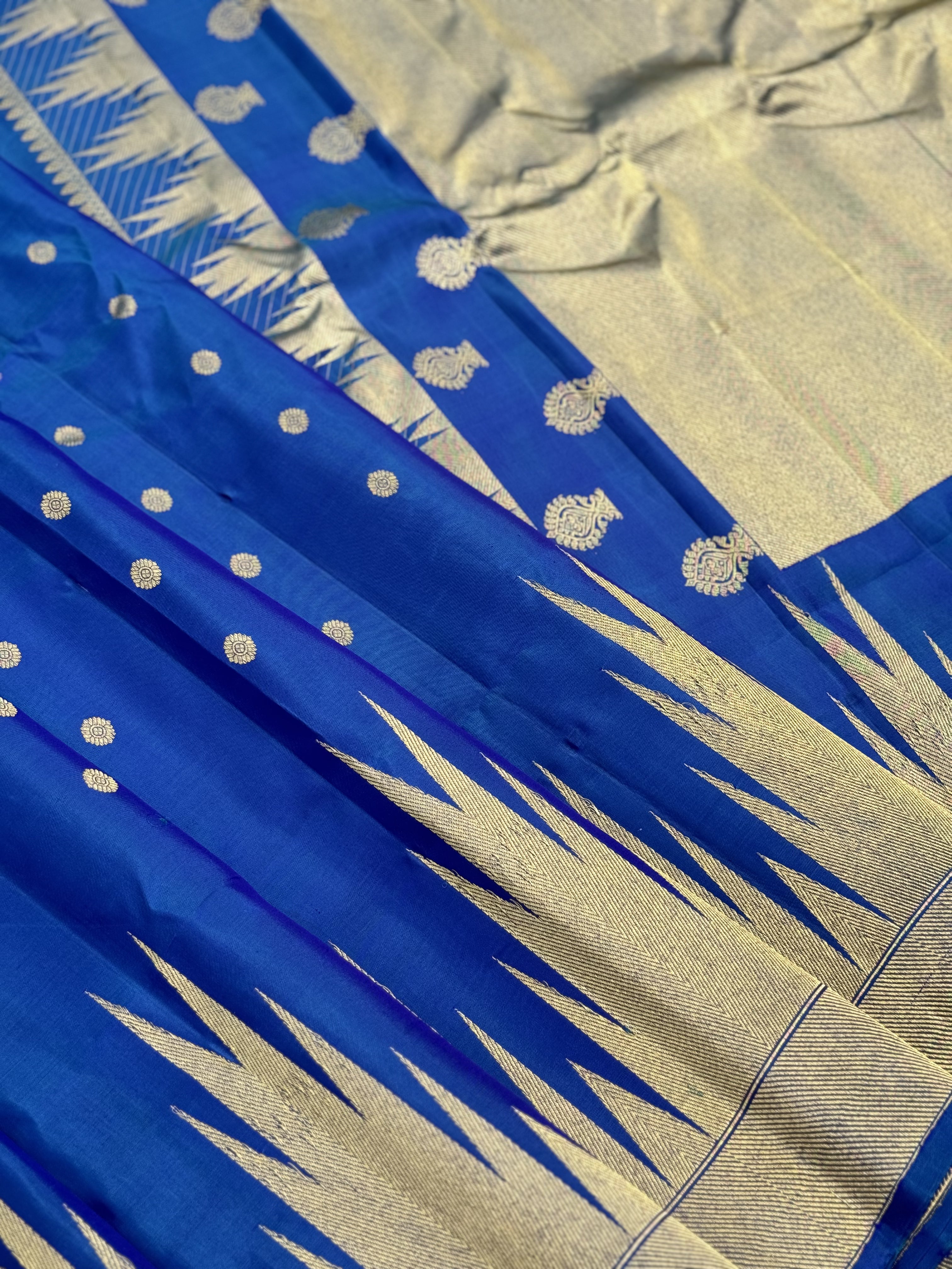 APURVA - Handwoven A gorgeous antique gold with zari woven peacock blue gadwal saree