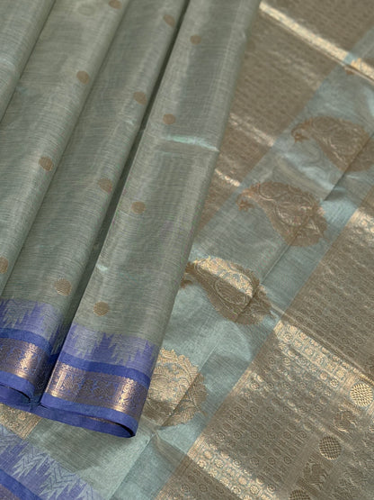 Kanchi silk cotton saree in sage green with blue shade zari woven