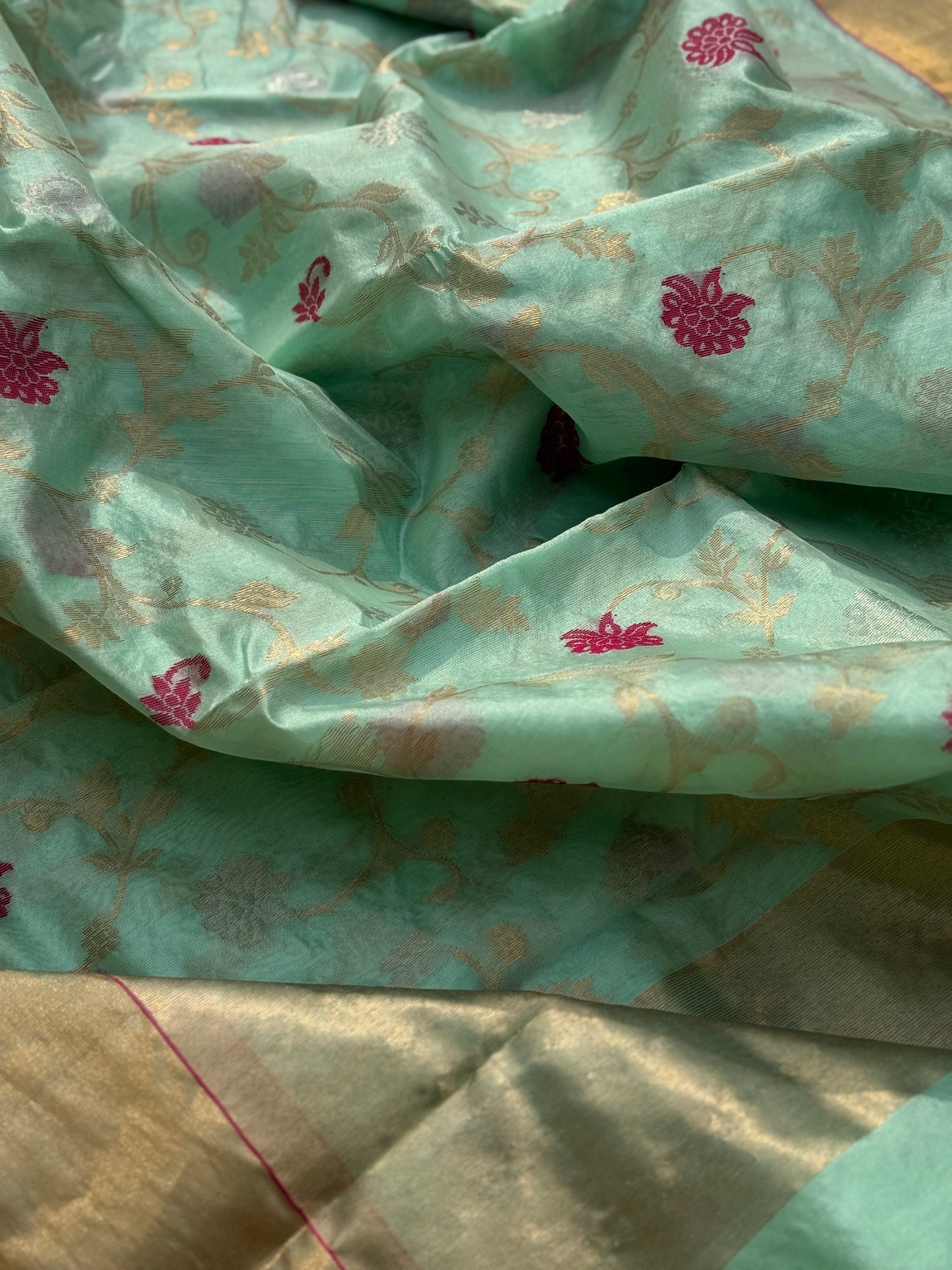 A foam green handwoven chanderi silk saree with full jaal weave ek naal and meenakari