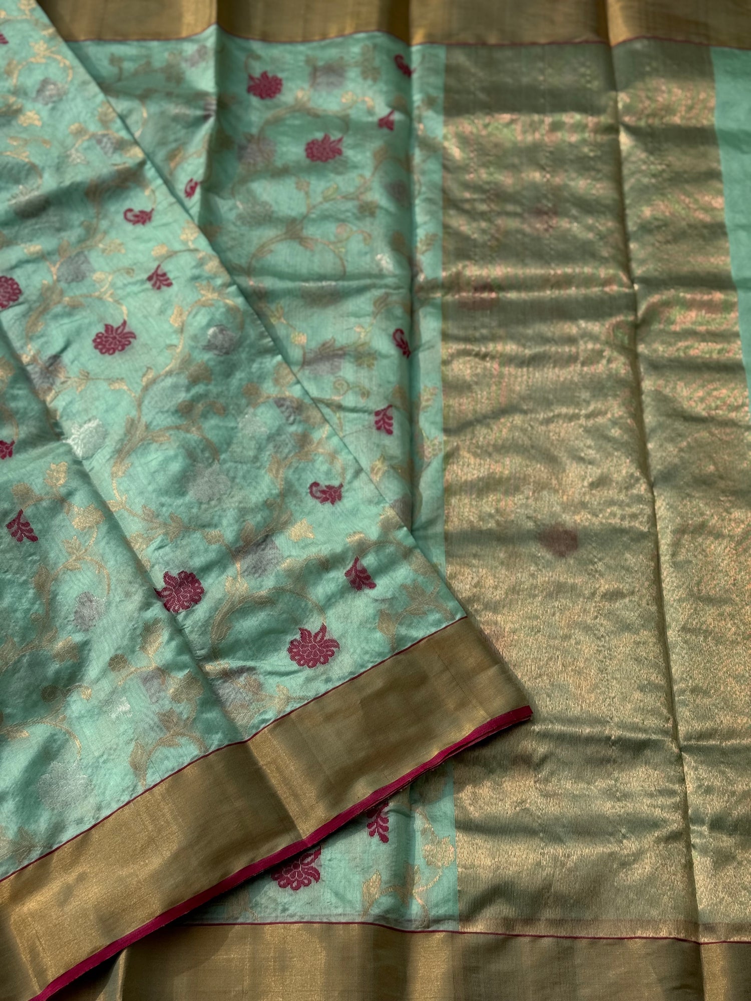 A foam green handwoven chanderi silk saree with full jaal weave ek naal and meenakari