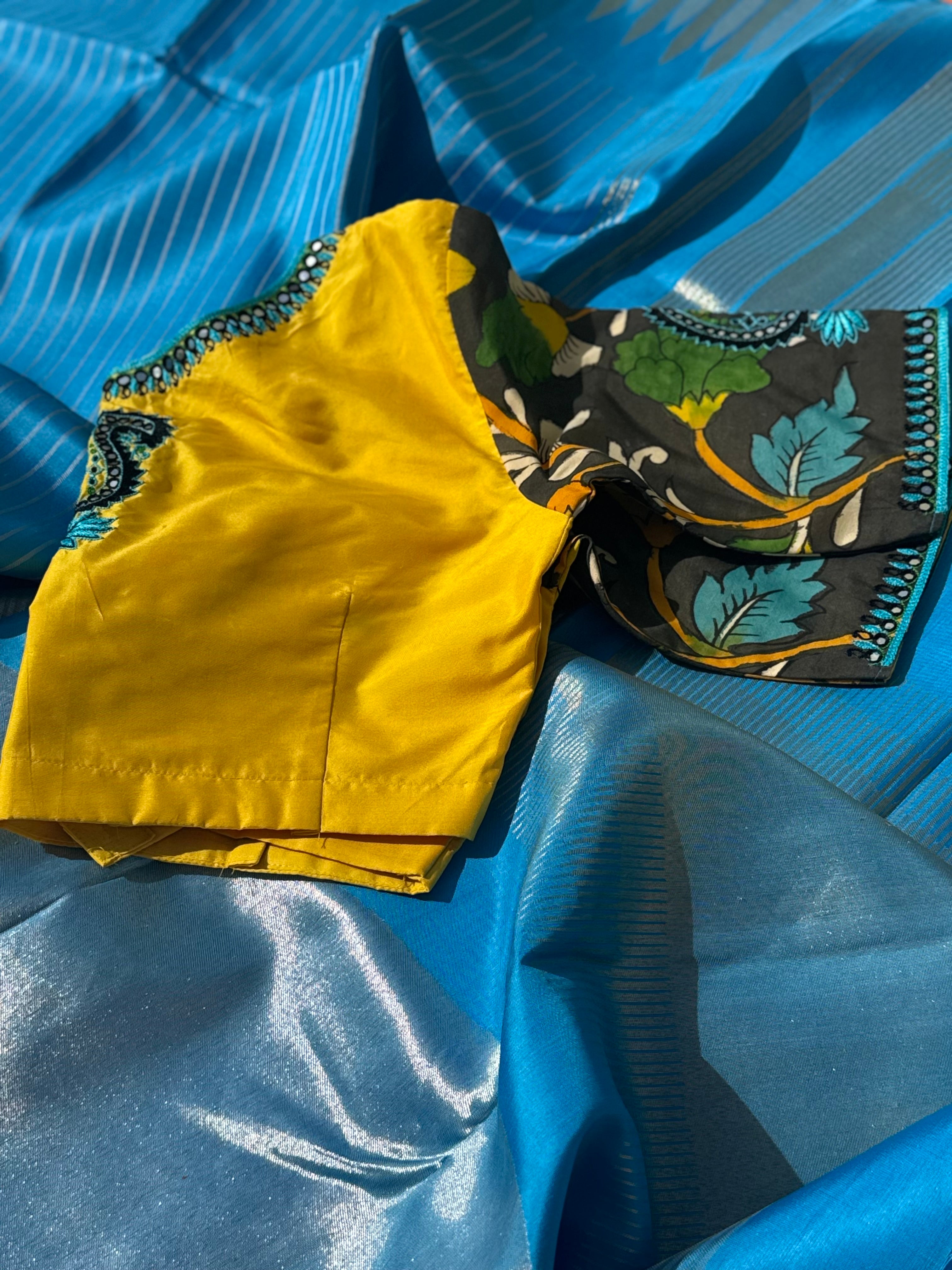 RAVIKKAI- The timeless classy ensemble vivid blue with yellow silk penkalamkari