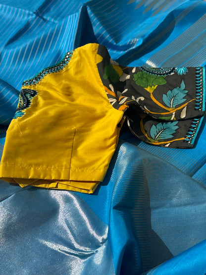 RAVIKKAI- The timeless classy ensemble vivid blue with yellow silk penkalamkari
