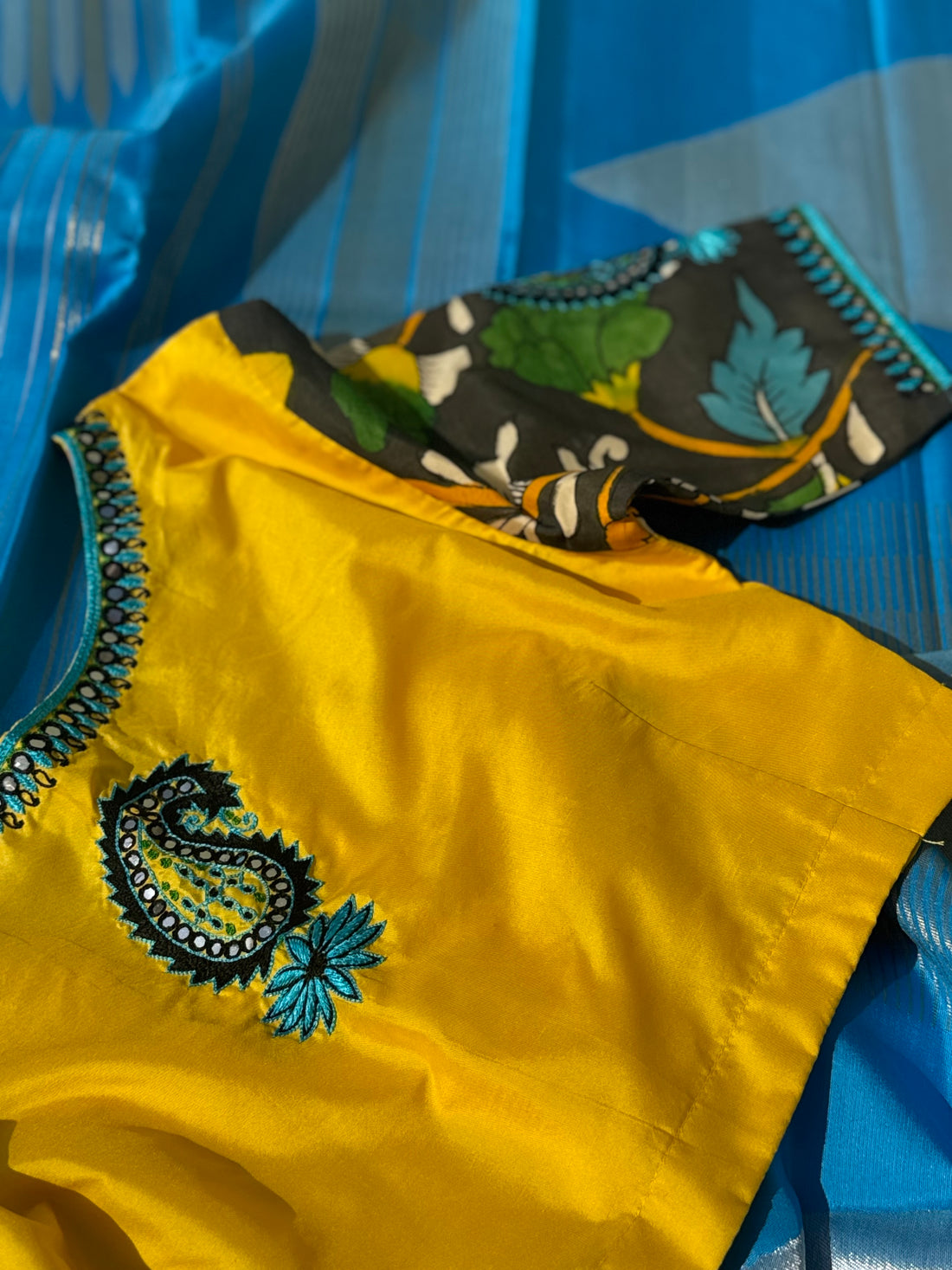 RAVIKKAI- The timeless classy ensemble vivid blue with yellow silk penkalamkari