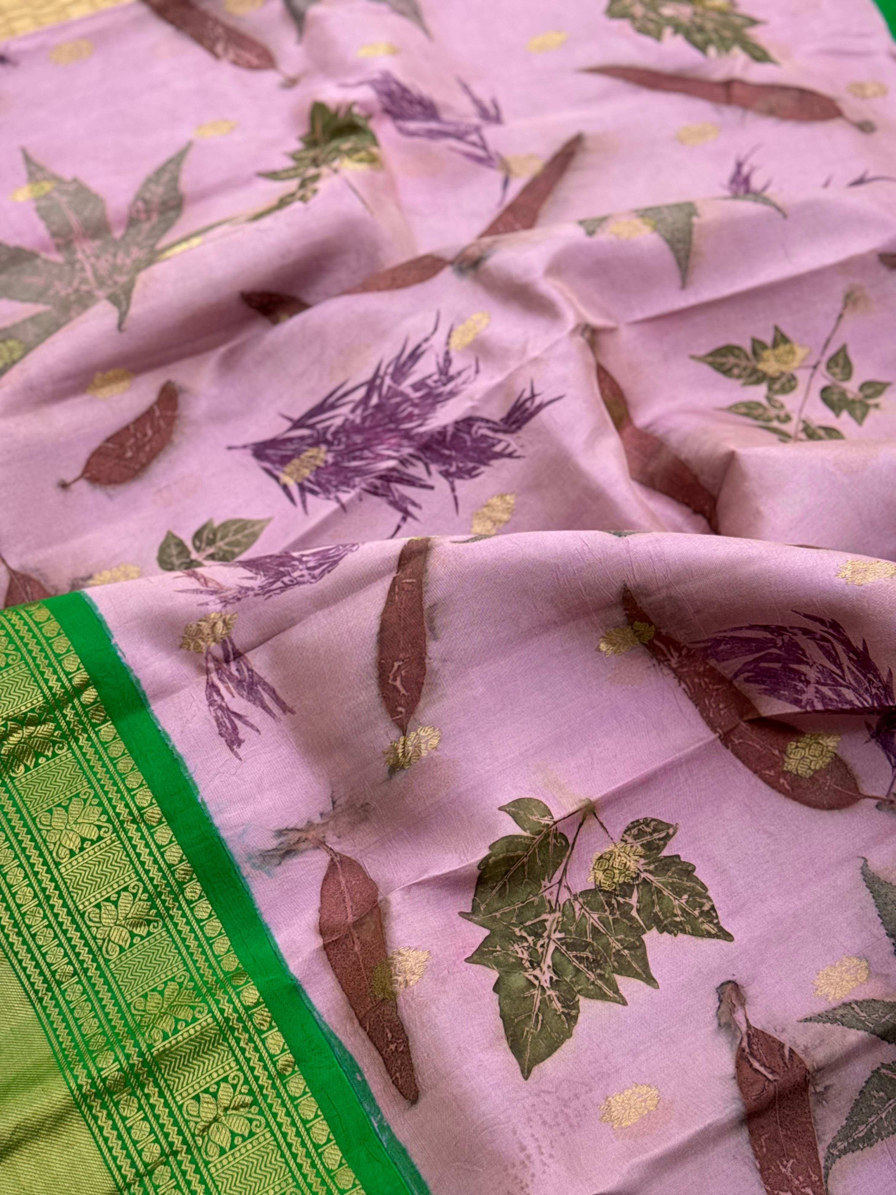 A gorgeous natural ecoprints done on mauve pink with green kuttu gadwal silk saree