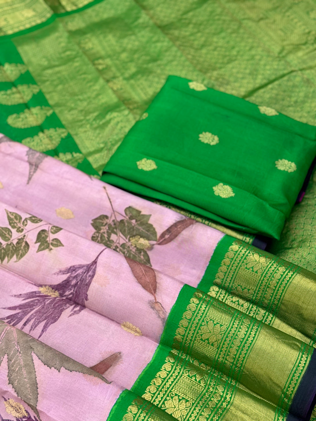 A gorgeous natural ecoprints done on mauve pink with green kuttu gadwal silk saree