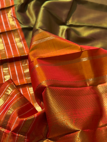 A Fern Green with orange masterpiece honeycomb motif korvai kanchivaram silk saree