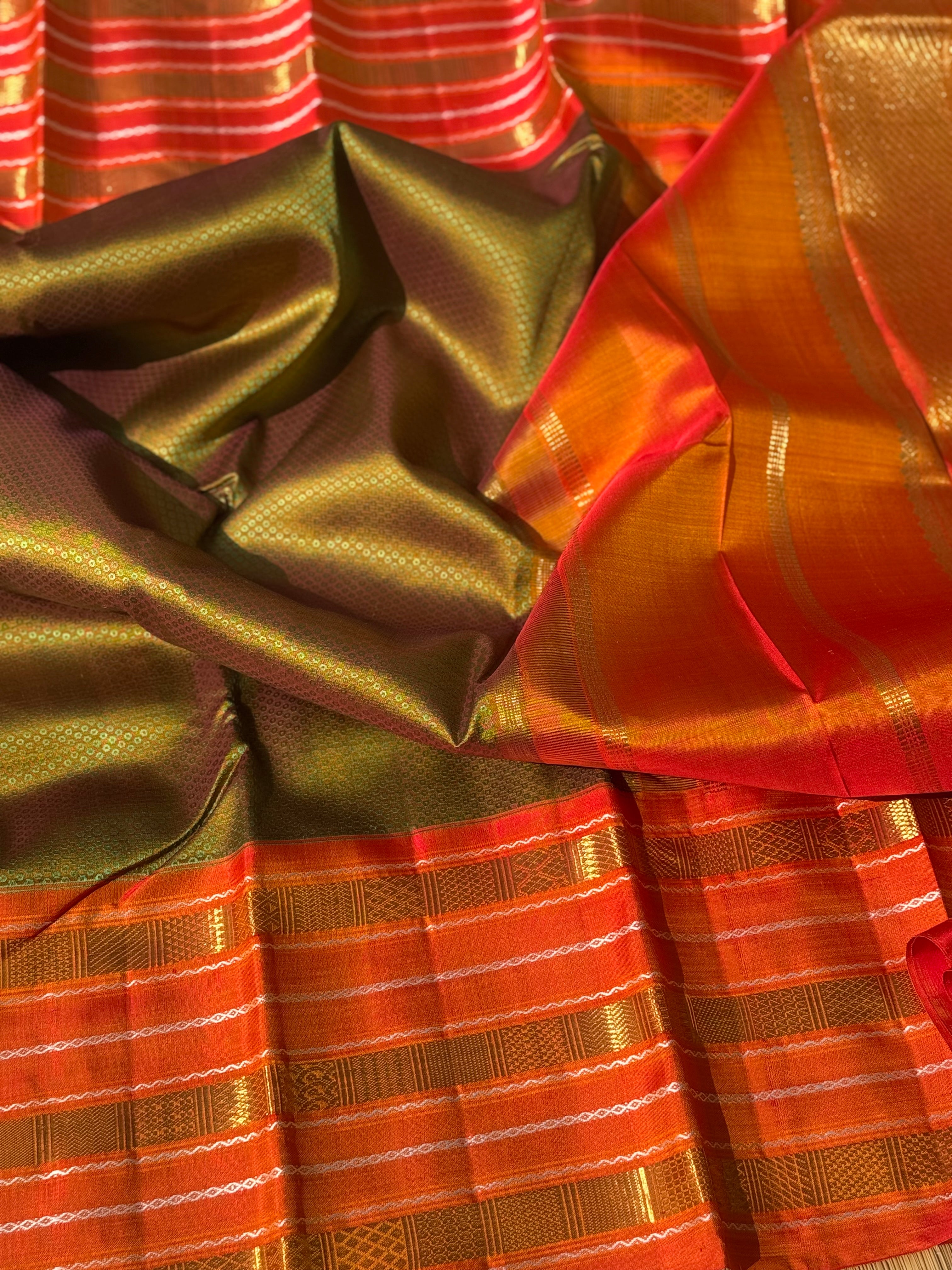 A Fern Green with orange masterpiece honeycomb motif korvai kanchivaram silk saree
